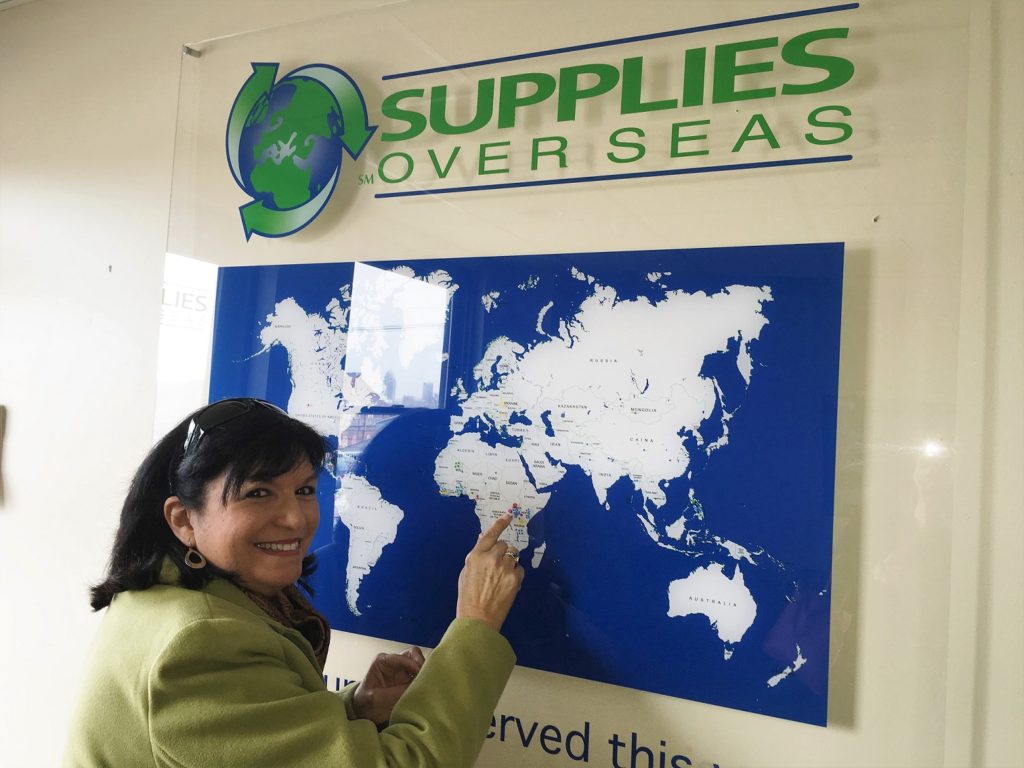 Women Pointing to world map in SOS office